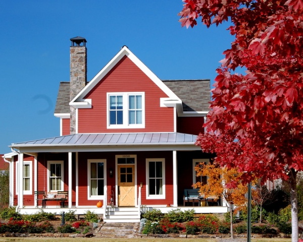 Farmhouse Exterior by Bret Franks Construction, Inc.