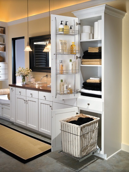 Farmhouse Bathroom by Hager Cabinets Inc.