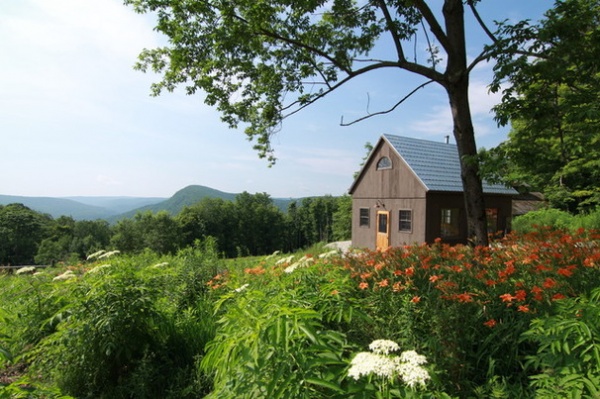 Rustic Exterior by Uncarved Block Inc.