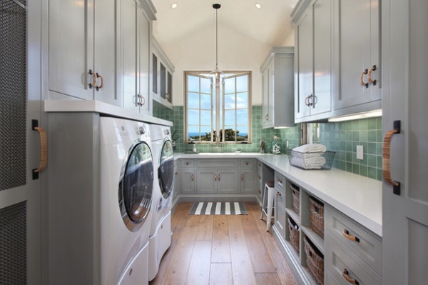 Mediterranean Laundry Room by Brandon Architects, Inc.