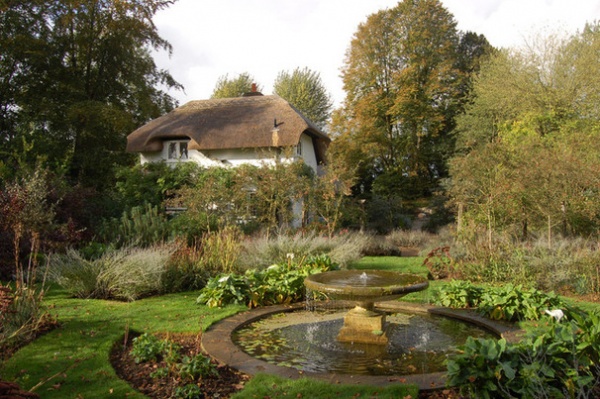 Traditional Exterior by Dodson Bros Thatchers LTD.