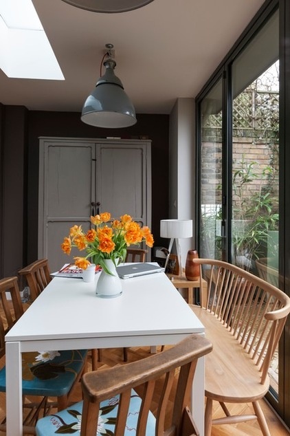 Eclectic Dining Room by Martins Camisuli Architects