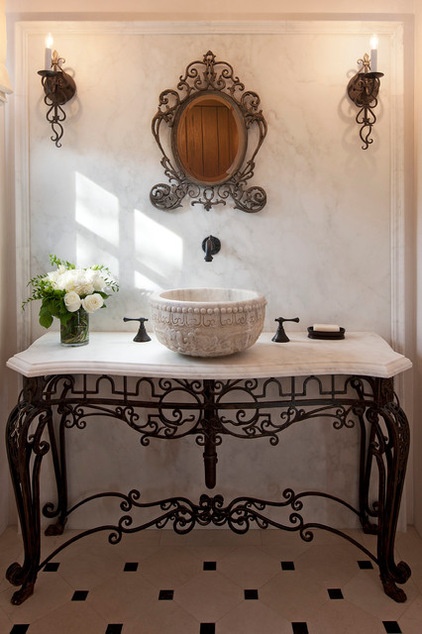 Mediterranean Powder Room by Studio 7 Architecture & Allied Arts