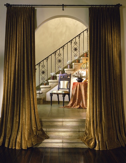 Mediterranean Staircase by Tommy Chambers Interiors, Inc.